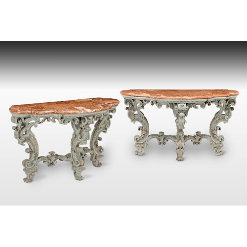 A magnificent pair of Italian, Piedmontese light blue patined and carved baroque Console Tables, with their original alabaster marble tops (alabastro fiorito), probably after the design of Filippo Juvarra.